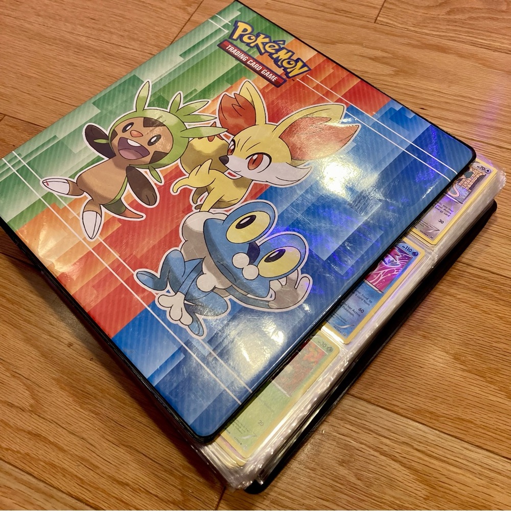 Pokémon card album with cards